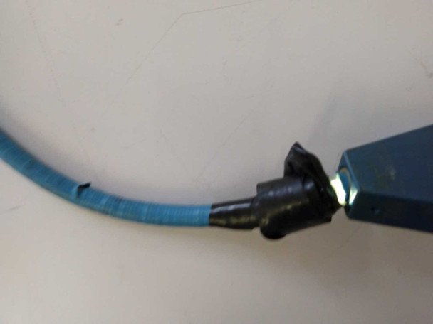 Close-up of fiber optic light guide blue vinyl trunk showing tear and crack in the outer shrouding near the blue aluminum splitter block input connector