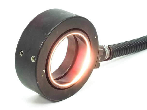 Dolan-Jenner A3739P ring light illuminated with red/orange fiber optic glow inside ring, demonstrating light transmission through the fiber bundle