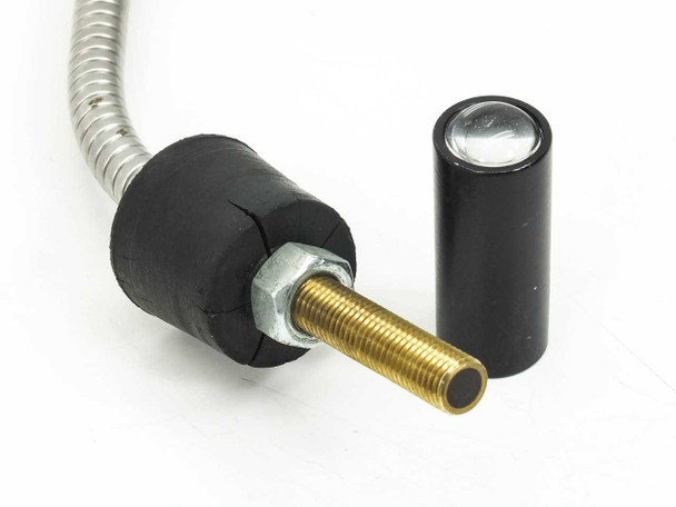 Output end of fiber optic cable with dispersing lens removed and placed alongside, showing the gold threaded 0.25 shaft and the separate black cylindrical dispersing lens with lens element visible