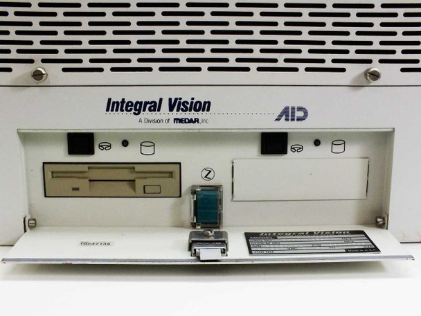 Integral Vision OMNI LD.400MM controller unit — front bay detail showing internal floppy drive, Zip-style removable media drive, AID / MEDAR Inc. branding, and a small Integral Vision identification label