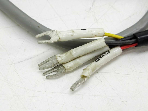 Wiring harness spade lug terminals close-up — multi-conductor cable with color-coded wires and insulated fork terminals