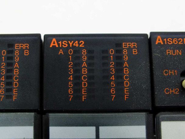 Mitsubishi MELSEC A1SY42 output modules close-up showing channel labeling A0-F and ERR indicator