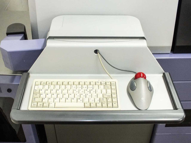 Camtek Falcon PD – operator console with compact keyboard and trackball mouse on sliding tray