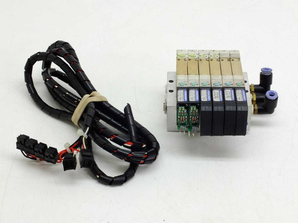 Koganei F10M6AJ pneumatic manifold assembly front view showing 6 valve stations and solenoid coils