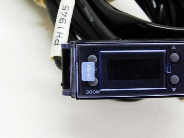 Keyence FS-V1 amplifier close-up of front digital display panel with MODE button and up/down arrows
