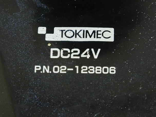 Tokimec DC24V label close-up showing brand name, voltage rating DC24V, and part number P.N. 02-123806