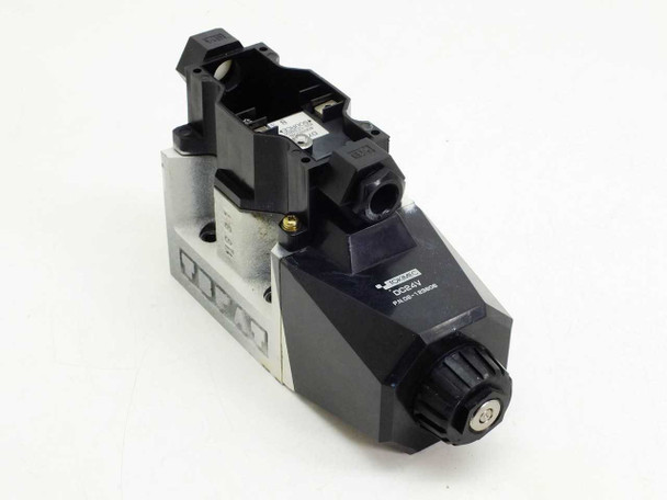 Tokimec 02-123806 D7-24 DC 24V hydraulic solenoid valve — front-left three-quarter view showing solenoid coil housing and valve body