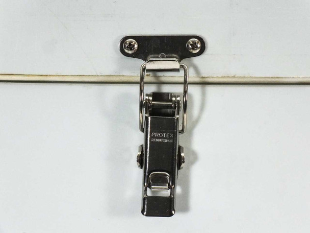 Close-up of Protex stainless steel toggle latch securing the chamber lid to the main body