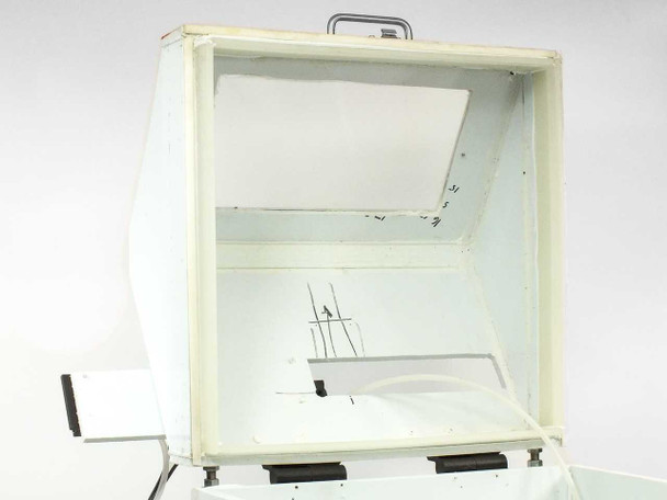 Interior view with lid fully open showing white HDPE-lined walls, drain fitting, and handwritten measurement markings