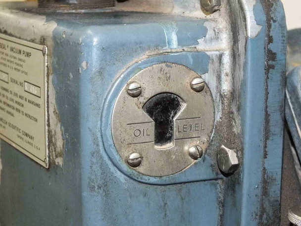 Welch Duo Seal R 1397 oil level window detail — second view showing wear and patina on pump housing