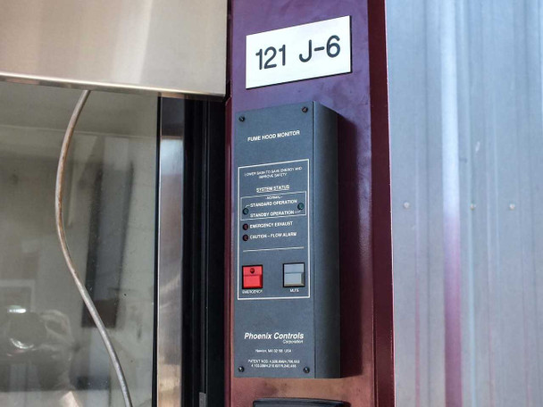 Phoenix Controls fume hood monitor panel labeled 121 J-6 showing system status indicators: standard operation, standby, emergency exhaust, and caution flow alarm LEDs
