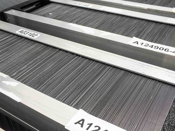 Close-up of Nanosolar NanoCell cell trays stacked in sequence, showing tray labels A03102 and A124906-41 clearly