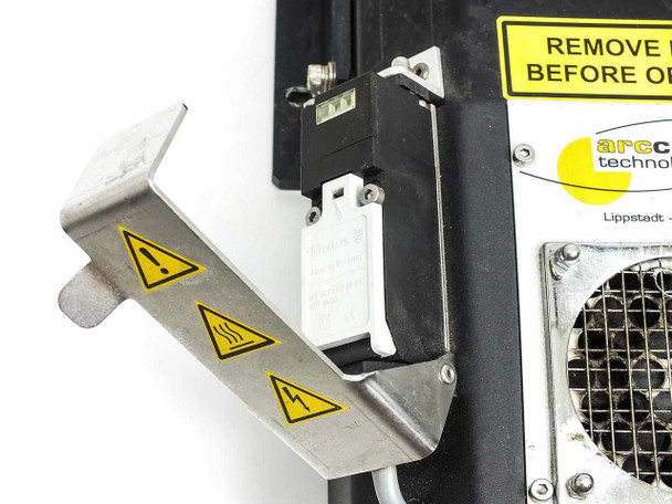 Arccure BK150 UV light source – close-up of interlock/safety switch assembly and warning labels on side panel
