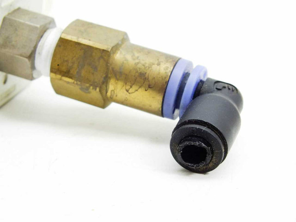 SMC ZSE30-01-25 – close-up of brass push-in elbow pneumatic fitting with blue O-ring and black quick-connect tube end