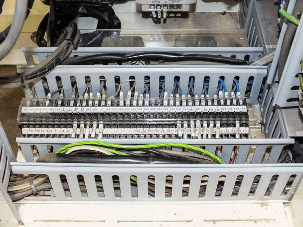 Terminal block wiring panel — multiple labeled terminal strips with green/yellow ground wiring