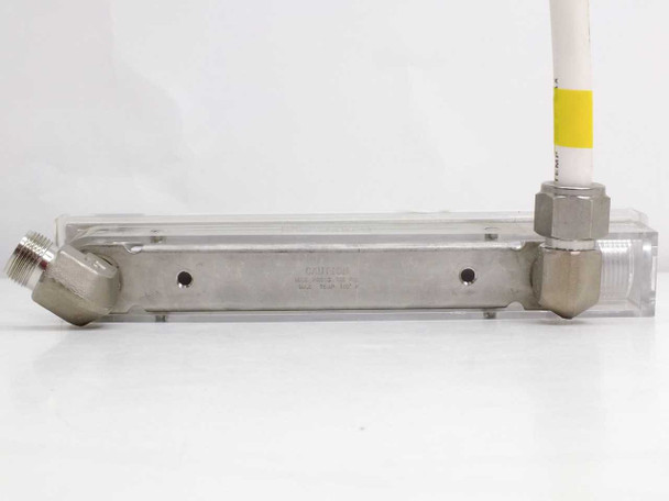 Dwyer RMB-54D-SSV flow meter — bottom of stainless steel manifold showing two mounting holes and 90-degree NPT fittings at each end