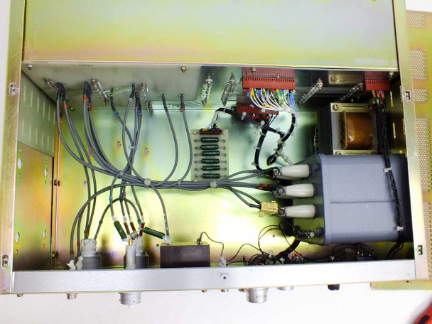 Riber ACE 1010 interior close-up – multi-conductor wiring harnesses, white ceramic high-voltage insulators, red terminal blocks, transformer, gray HV component block