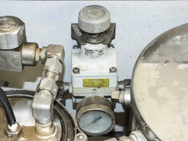 SMC pneumatic valve and pressure gauge detail on lacquer dispensing system plumbing assembly
