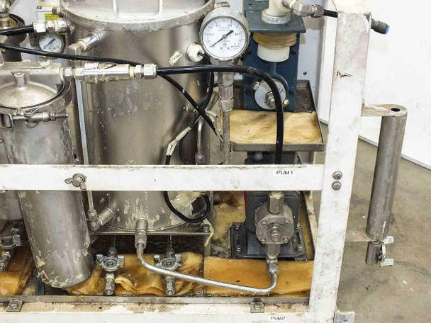 Right-side view of lacquer dispensing system frame showing stainless containers, pressure gauges, manifold, and PUM1 label