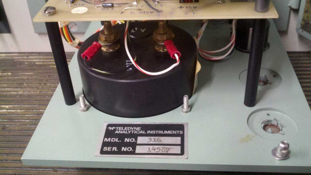 Close-up of Teledyne Analytical Instruments module label showing Model No. 316 and Serial No. 14587, with toroidal transformer and circuit board visible