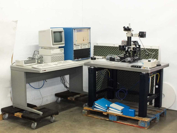 Nano Instruments Nanoindenter system overview — full lab setup showing control cabinet, HP 9000 workstation desk, and indenter microscope stage on isolation table