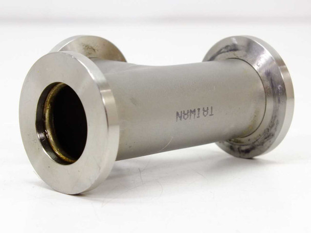 KF25 vacuum tee fitting side profile showing cylindrical body with 'TAIWAN' stamp and two end flanges; light surface marks on body