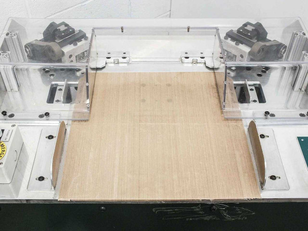 Uni-Solar MX1-711-000-5 — top view showing both cutting head assemblies flanking the 14.5-inch wide work surface with protective acrylic covers