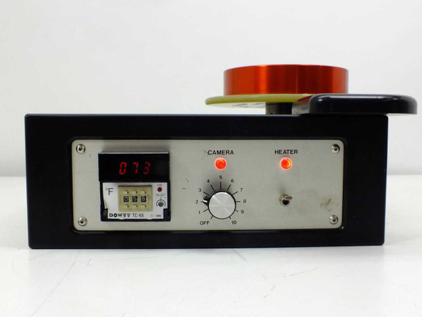 Dowty TC-48 Temperature Controller front-angle view — LED display reads 073°F, Camera and Heater LEDs illuminated, heated winder coil on top