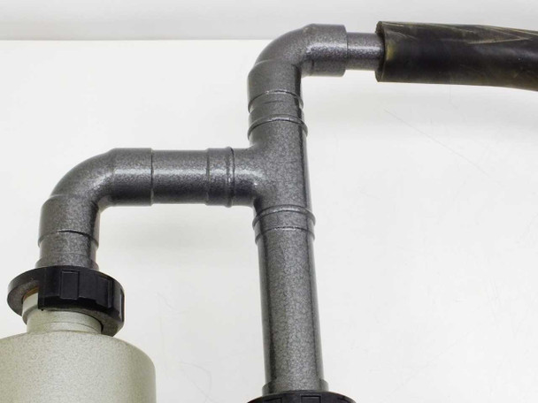 Edwards vacuum system changeover valve — T-junction flexible vacuum hose piping detail with black bellows hose