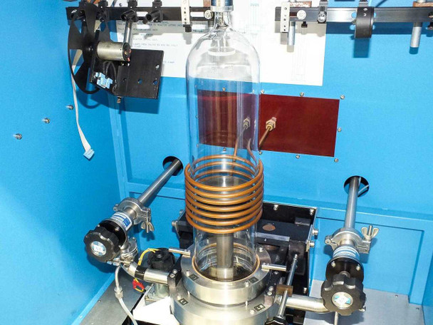 Close-up of Lepel RF induction coil surrounding quartz reactor tube with susceptor assembly and gas inlet fittings