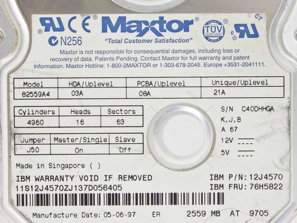 Maxtor 82559A4 label close-up showing model, HDA/PCBA/Unique uplevel codes, cylinders/heads/sectors, jumper settings, IBM FRU 76H5822, P/N 12J4570, and manufacture date 05-06-97