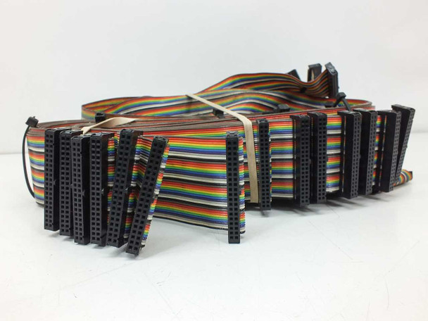Large bundle of rainbow ribbon cables with IDC connectors included with the backplane — laid flat on white background