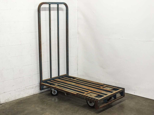 Cost Cutter industrial platform cart angled view showing slatted wood and steel deck, removable upright, and 4 solid rubber casters