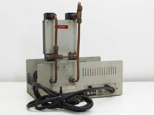 CEC 26-303 Moisture Monitor rear and side view showing copper gas tubing connections, rear panel with AC cord, recorder terminals, and ventilation slots