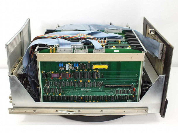 Nicolet 1270 IDACS – interior view with top cover removed showing internal card cage with multiple populated PCBs, ribbon cables, and flat cables interconnecting boards