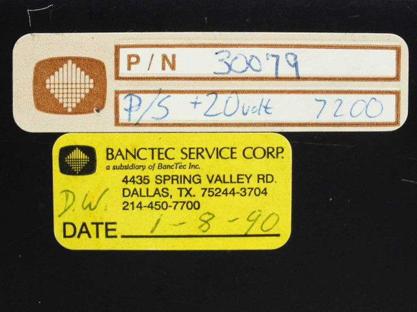 Close-up of panel labels showing Part Number 30079, P/S +20 Volt 7200, and BancTec Service Corp service tag dated 1-8-90