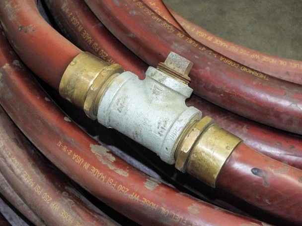 Thermoid Cobra fuel oil hose – galvanized tee fitting close-up showing dual brass unions and vent/bleed port on top