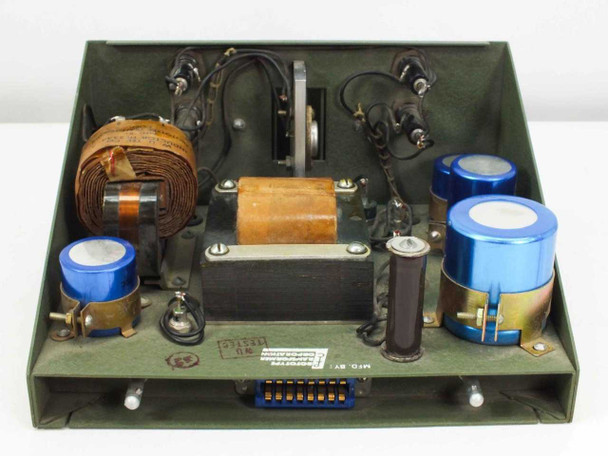 PTC 10190-A interior — top-down view from slightly different angle showing wound transformer cores, filter capacitors, inductor, wiring, and multi-pin edge connector at rear