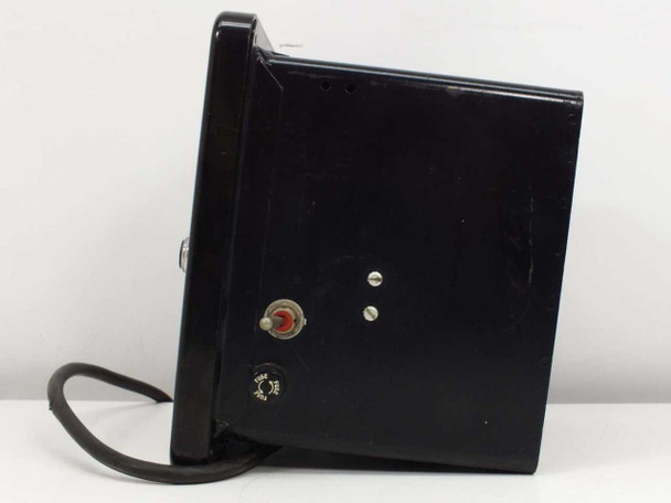 Left side view of Wheelco Amplitrol 152 temperature indicator showing toggle switch, red indicator, and attached AC power cord