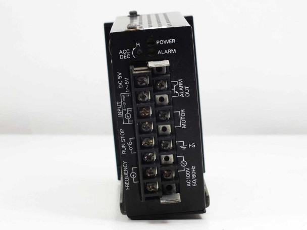 Iwaki FE-110 Single Inverter — top-down angled view of terminal block showing ACC/DEC, Power, Alarm, Input, Run/Stop, Frequency, Motor, FG, and AC100V connections