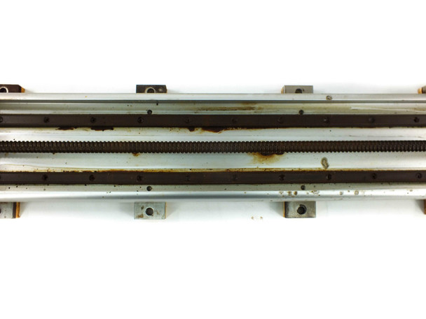 Yamaha LS1BL-850 close-up top view of ball screw and linear guide rails showing rust and corrosion along full length