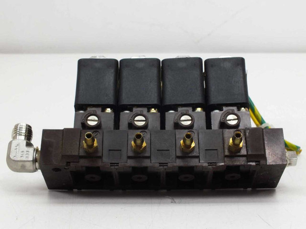 Asco 4-valve solenoid manifold – straight-on front view showing all four coil blocks, brass barb fittings on manifold body, and side inlet fitting