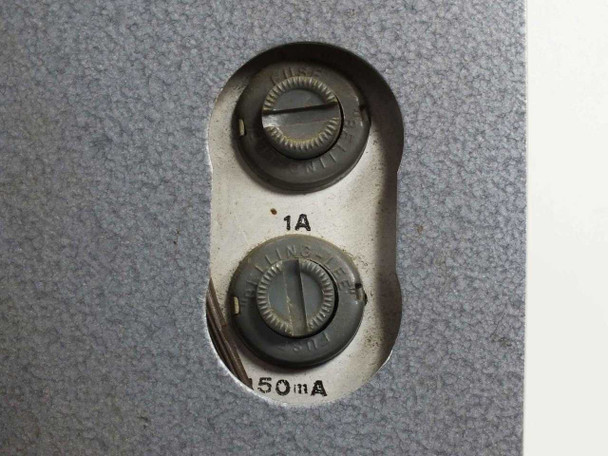 Close-up of rear fuse panel showing two fuse holders rated 1A and 150mA