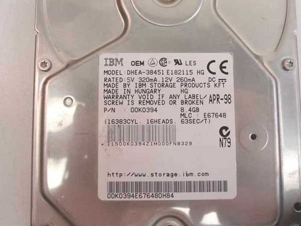 IBM DHEA-38451 label close-up showing model DHEA-38451 E182115 HG, P/N 00K0394, 8.4GB, rated 5V 320mA 12V 260mA, manufactured April 1998 in Hungary