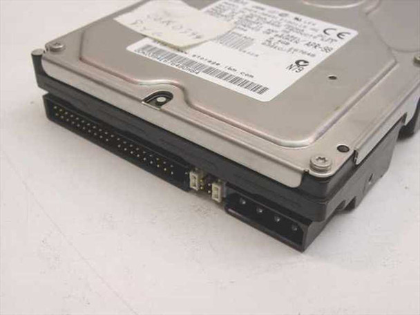 IBM DHEA-38451 3.5 inch IDE hard drive side edge view showing 40-pin IDE data connector and 4-pin power connector with jumper block