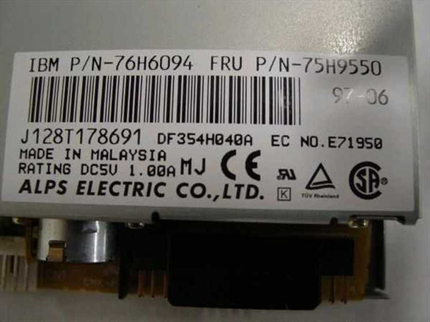 Alps DF354H040A floppy drive – label closeup showing IBM P/N 76H6094, FRU P/N 75H9550, model DF354H040A, DC 5V 1.00A rating, Made in Malaysia, Alps Electric Co. Ltd.