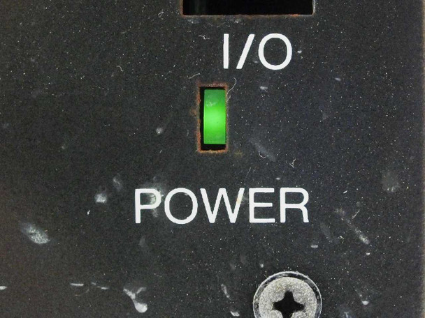 Close-up of Yamaha DRC-2 front panel showing illuminated green I/O power indicator LED lit, with POWER label and captive screw below