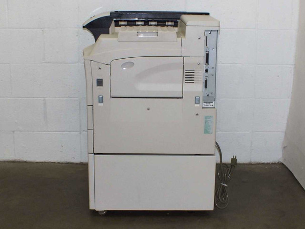 Kyocera Mita FS-9500DN left rear view — output tray and rear interface panel visible