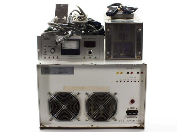 Tokyo Foton TFL 150 UV lamp curing system overview — UV2 power unit (front), Fotcure UV controller (upper left), and accessory/enclosure unit (upper right) with interconnect cables