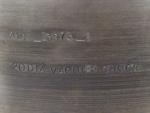 OS Walker AXM-13973-1 side wall — stamped markings reading AXM_13973_1 and 20 DIA VACUUM CHUCK